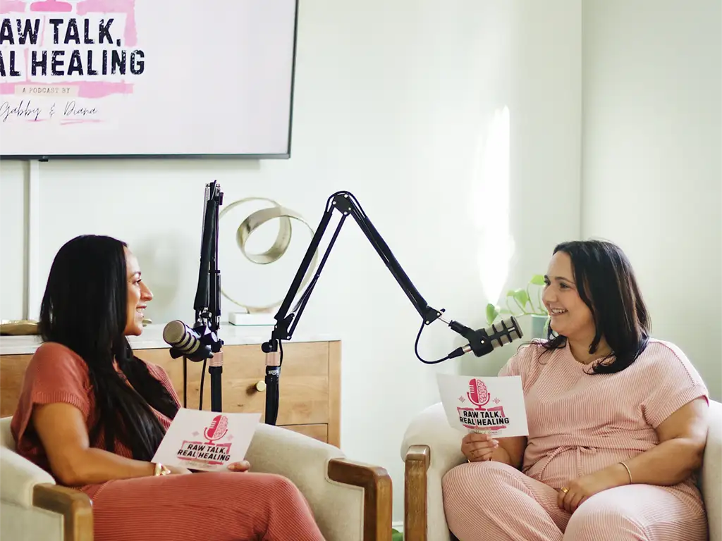 Gabriella Passamante recording an episode of the Raw Talk, Real Healing podcast with her co-host.